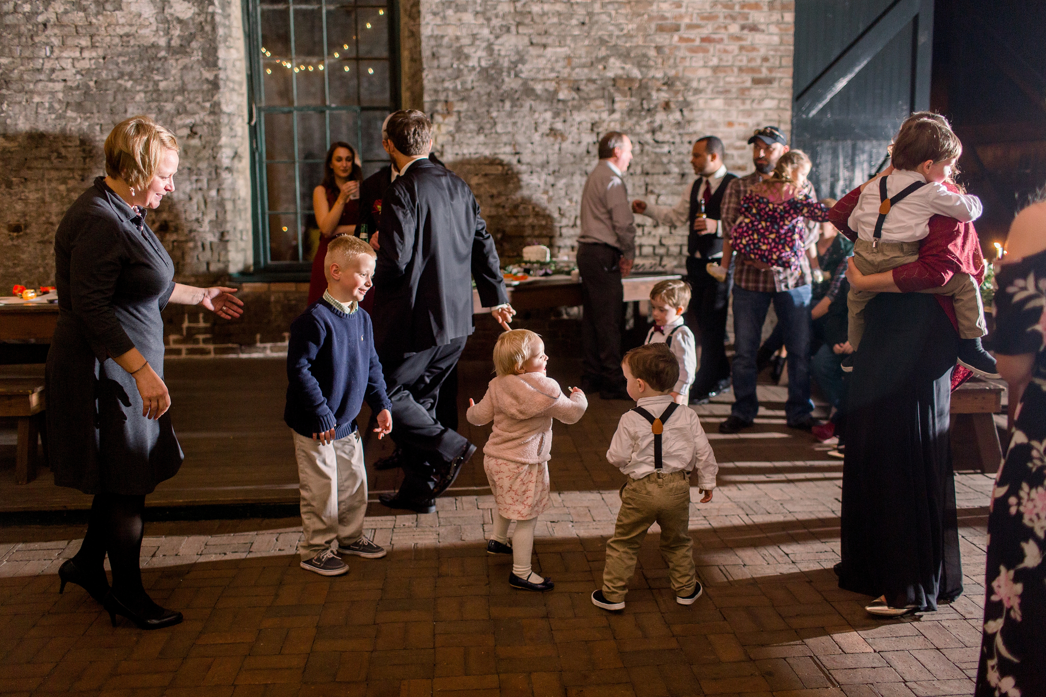 Little kids dancing at wedding reception.
